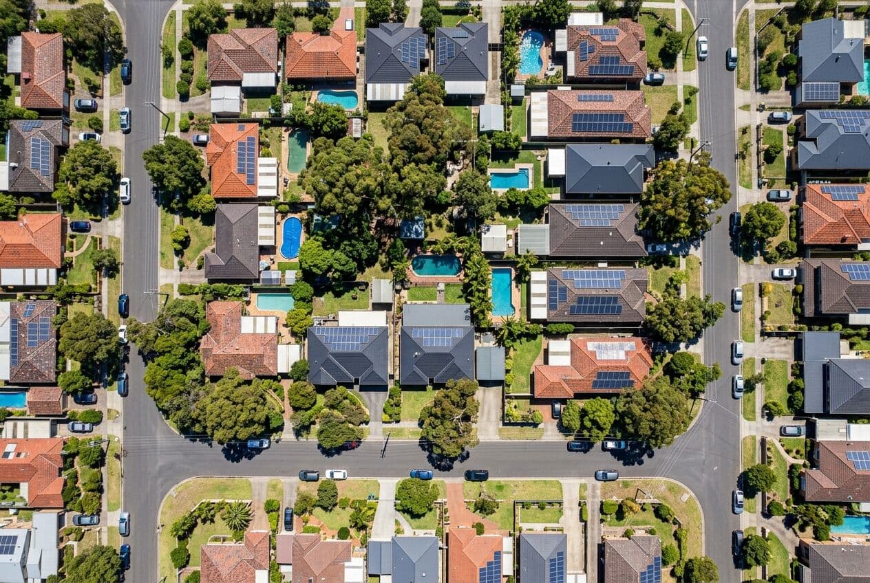 Aerial view of Australian suburban homes with rooftop solar panels